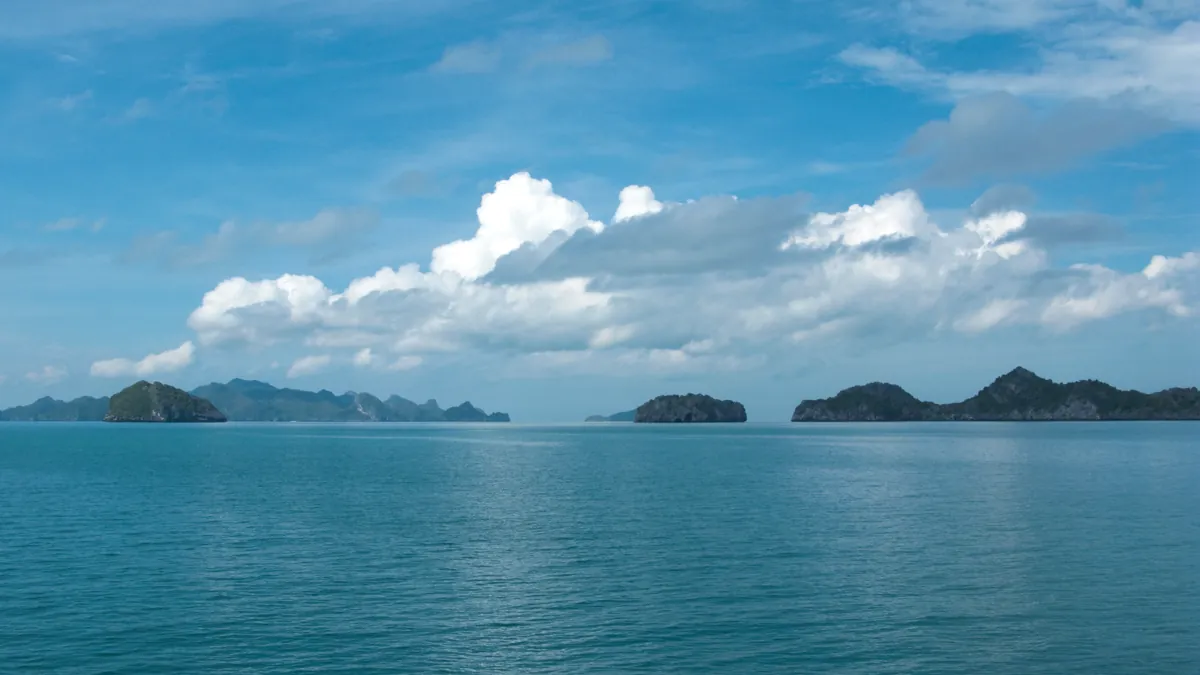 Ang Thong limestone islands seen across calm open water