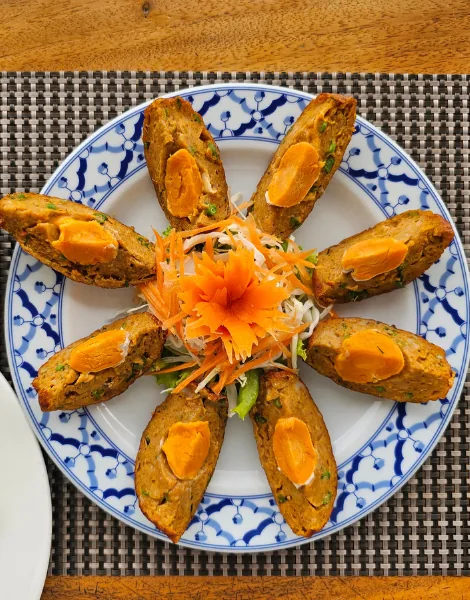 Fish cakes topped with Chaiya salted egg photographed for A Chef's Tour Samui Suppers evening food tour