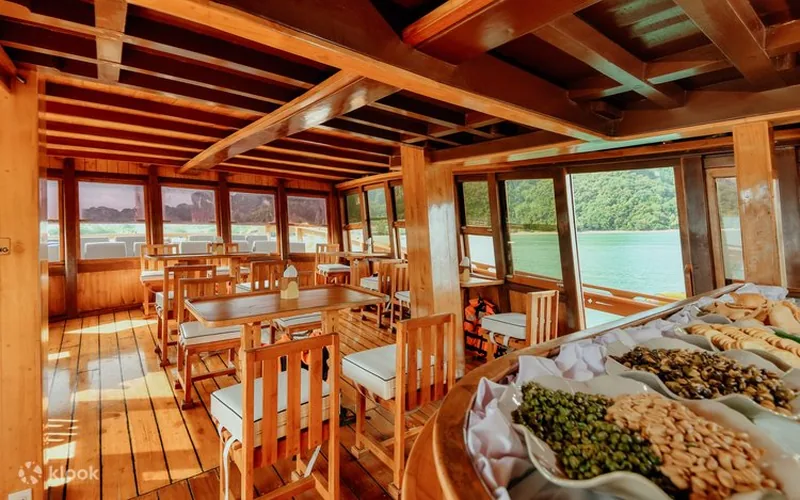 Teak dining interior on the M/Y Lalida Krabi sunset cruise