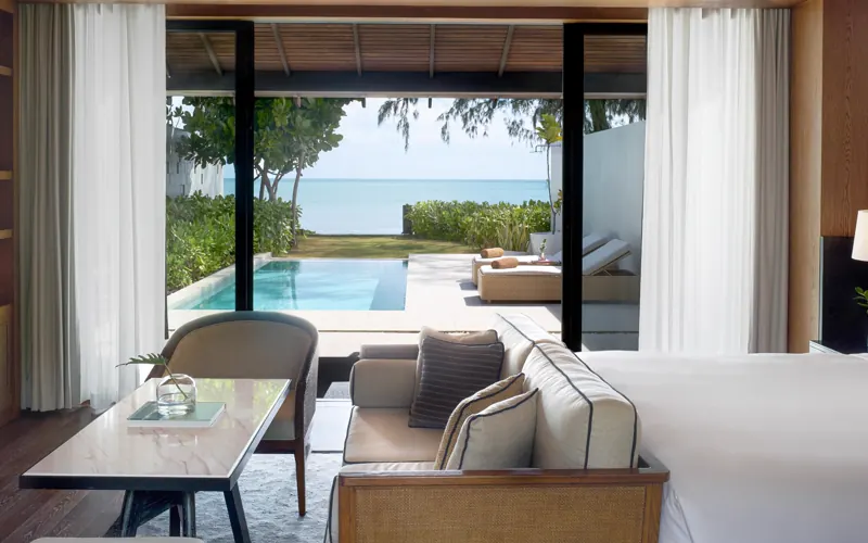 Kimpton Kitalay Samui One-Bedroom Oceanfront Pool Villa interior opening to private pool and sea