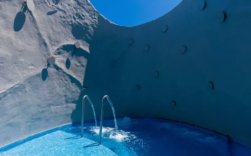 Blue hydrotherapy pool within the NAAM wellness circuit at Varana Hotel Krabi