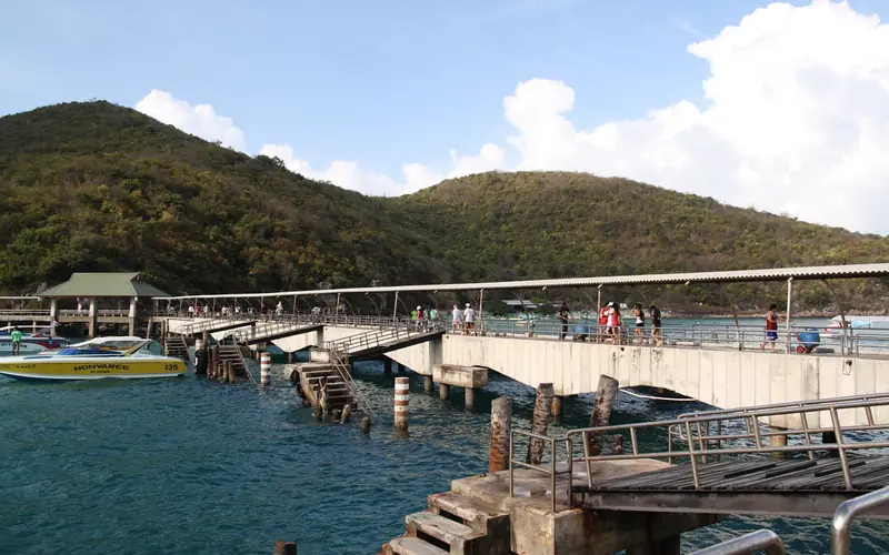 Passenger pier on Koh Larn with boats and covered walkway